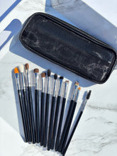 Load image into Gallery viewer, Set of makeup brushes with a black case on a marble surface